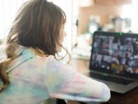 Image of a young person using a laptop