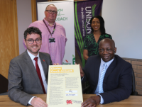 Image of people signing the Anti-Racism Charter