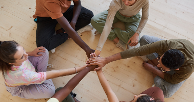 Group of people holding hands