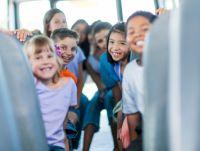 Image of school children on a bus