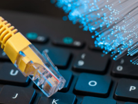 Image of ethernet cable, keyboard and fibre optics