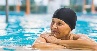 A lady resting in the water after swimming